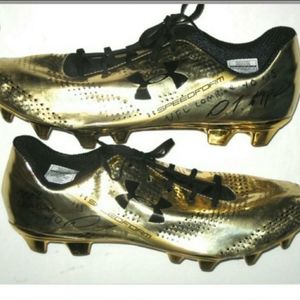 Gold soccer shoes